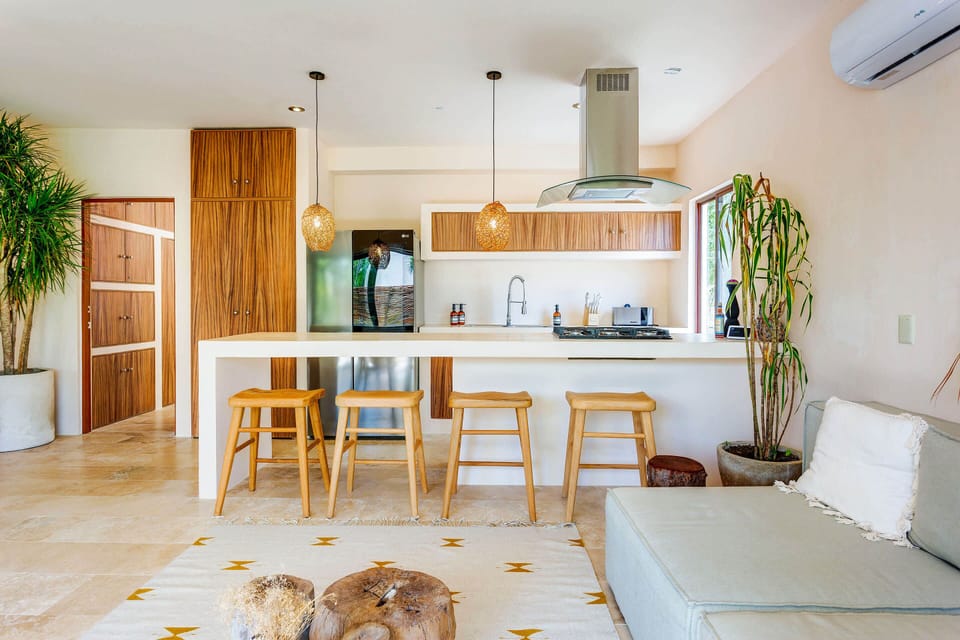 A fully-equipped kitchen & breakfast bar for meals at home