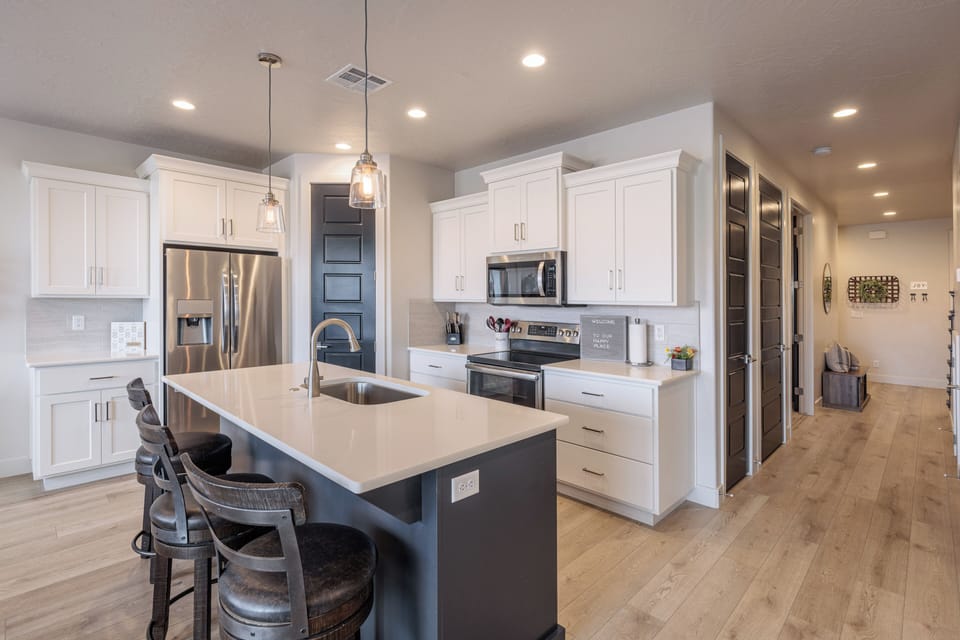 Kitchen Side View - Discover the heart of the home in the meticulously designed kitchen, where modern functionality meets timeless elegance.