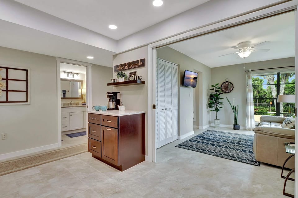 Your den with the double doors opened to the kitchen