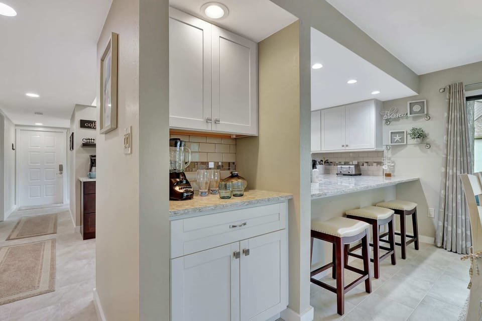 Your dry bar is located just beyond the kitchen counter