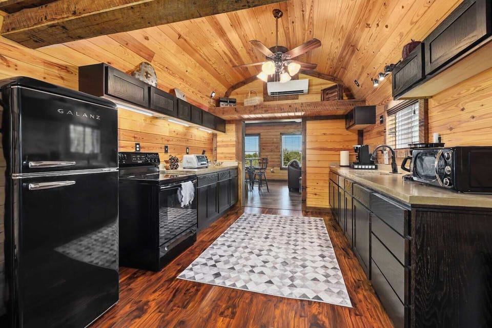 Opposite view of spacious, well-stocked kitchen