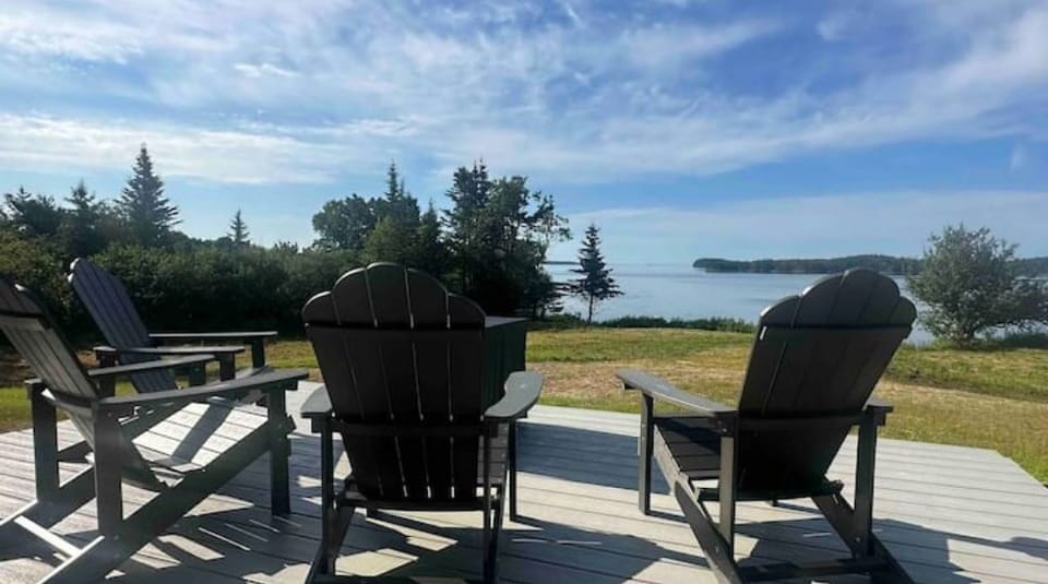 Enjoy watching the wildlife and tides from Adirondack chairs on the back deck