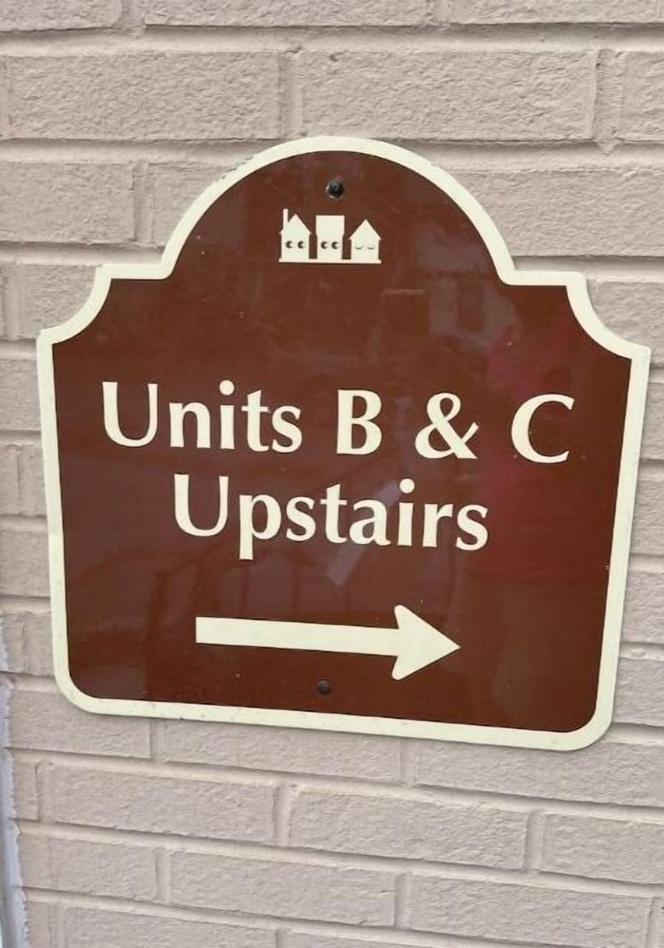 Unit C is located at the top of the stairs. 