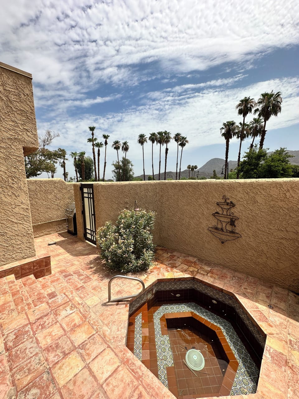Private patio with inground, Jacuzzi tub and grill. Entertainer’s delight.