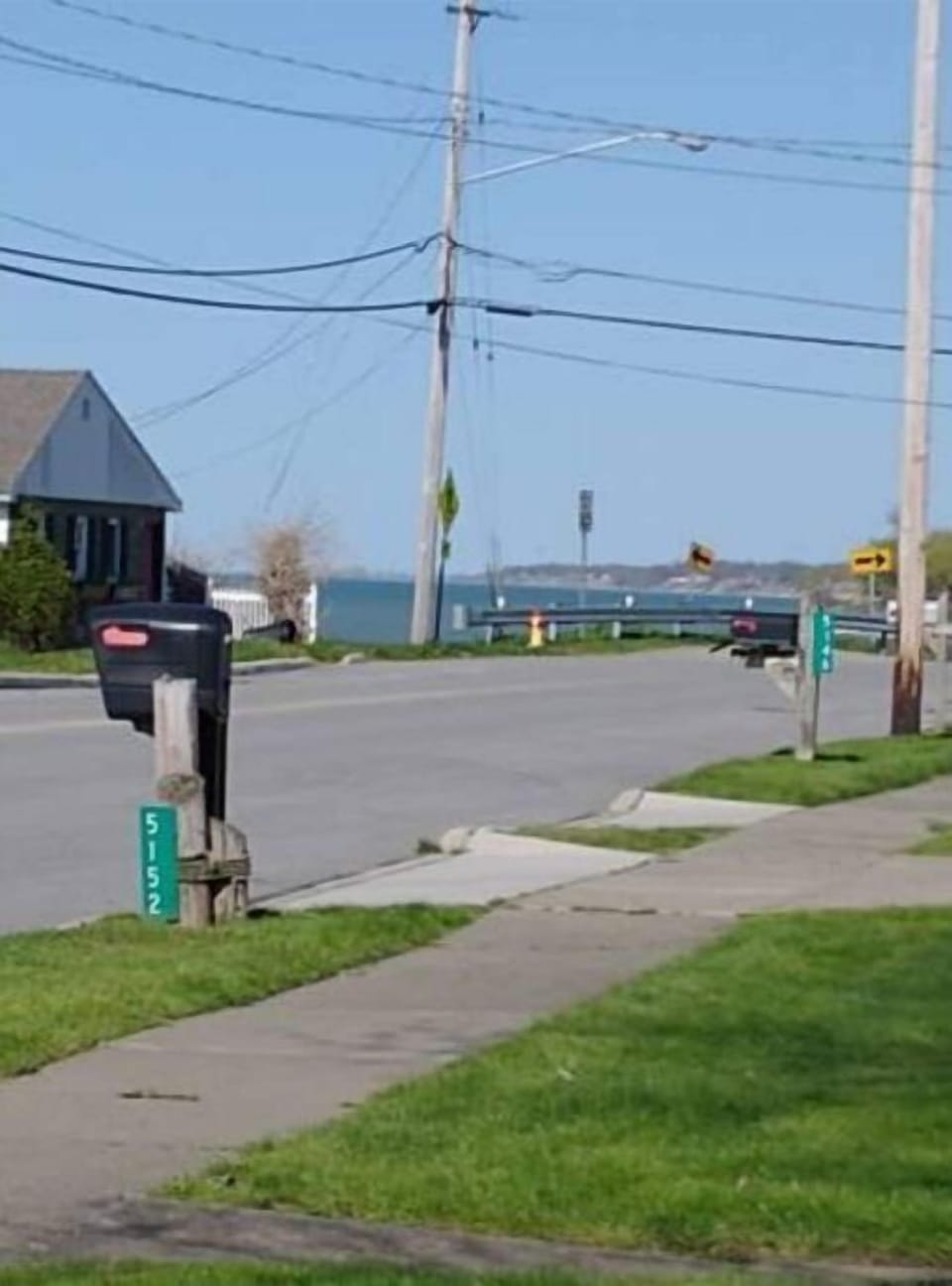 Photo taken in the front yard showing proximity to lake.