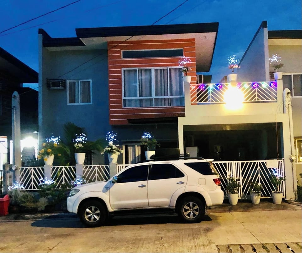 Night time in front of the House (with Christmas lights on)