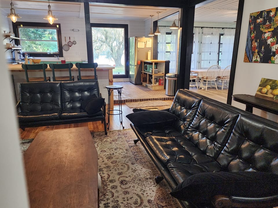 Living room looking into kitchen and dining areas