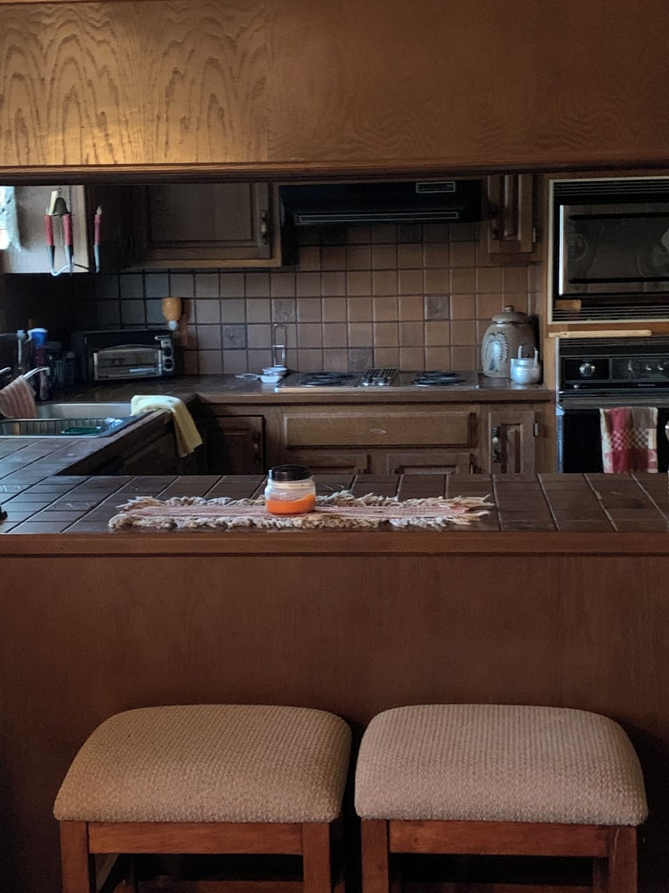 Full kitchen with tile countertops