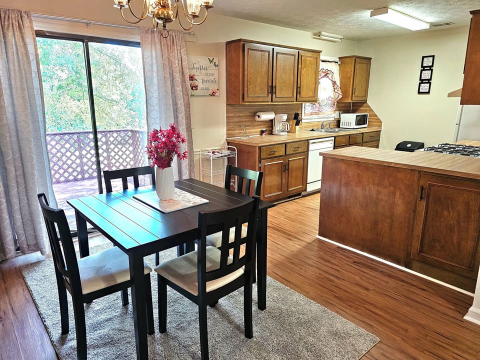 Kitchen, Dining area, and outside patio/deck 