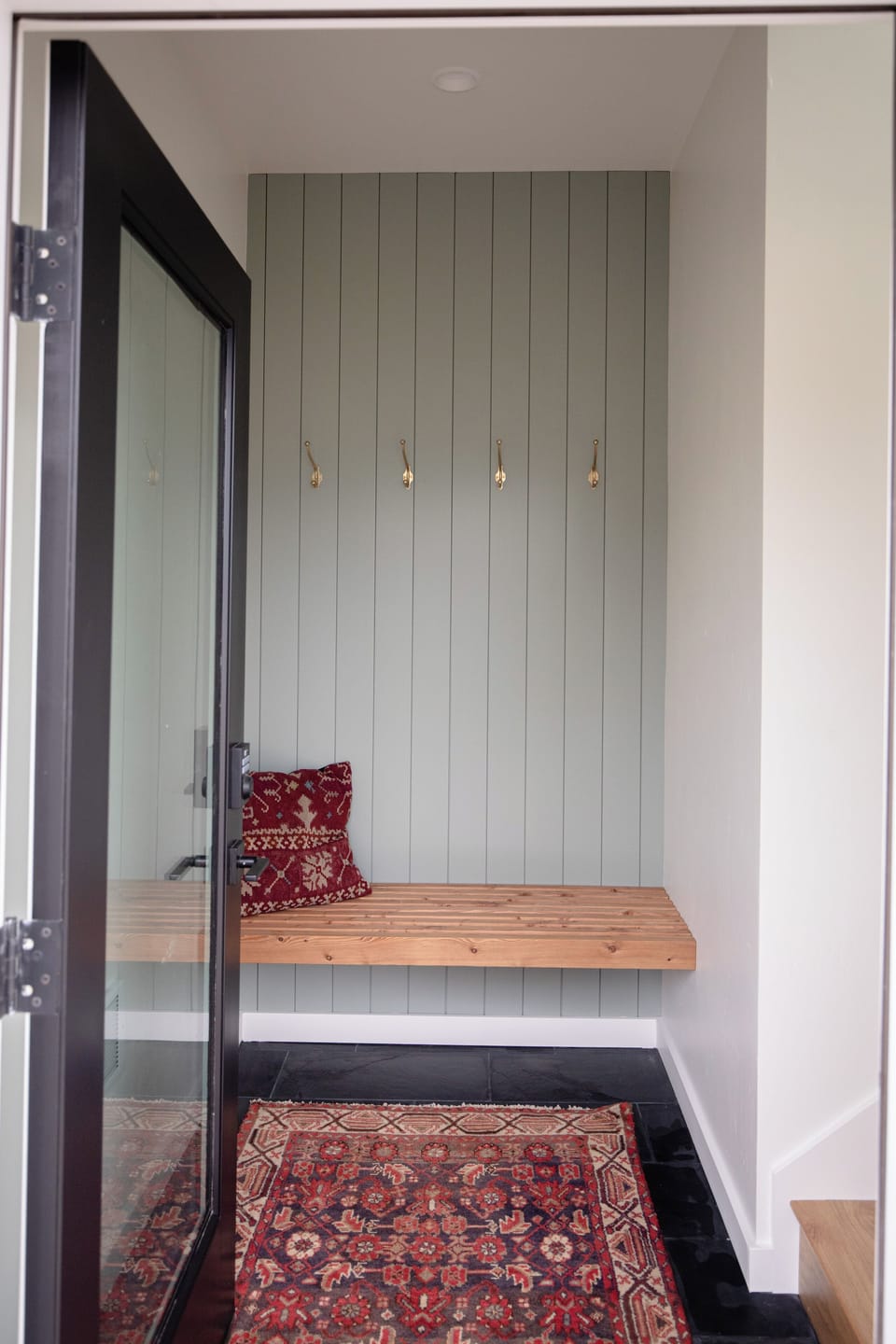 Entry with a bench and space for shoes and coats