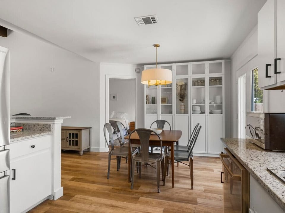 A sleek and open kitchen and dining area, ready for delicious meals and great memories!
