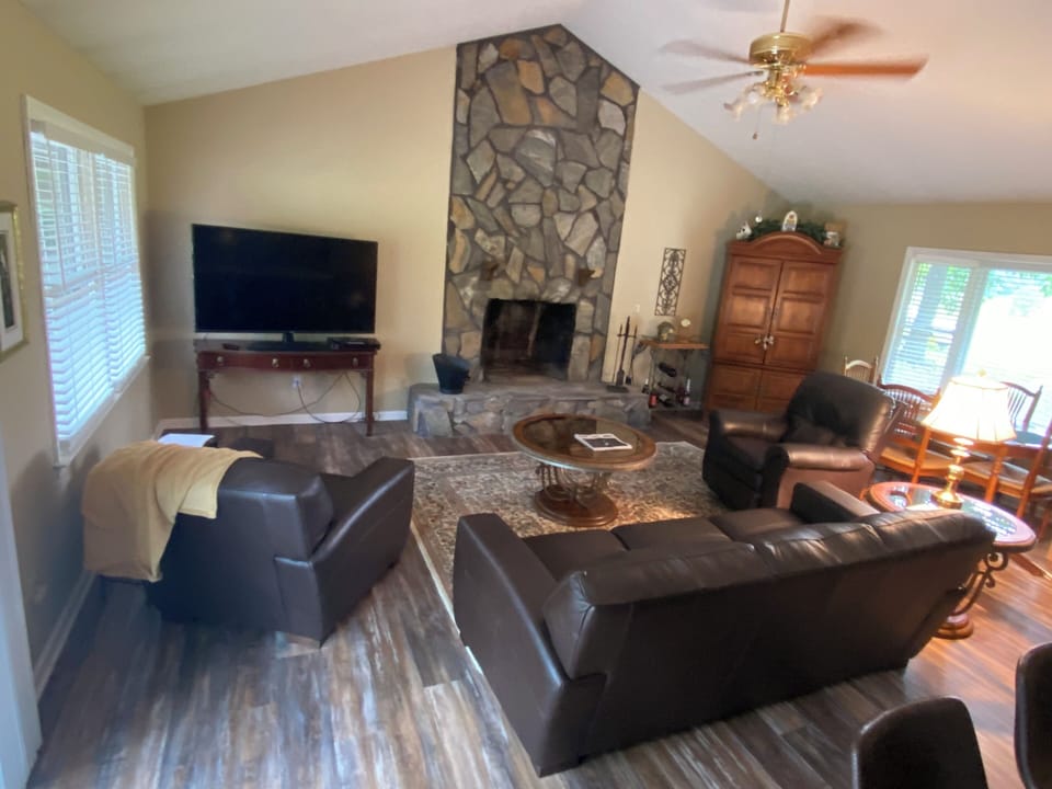 Den with gas logs and tv.