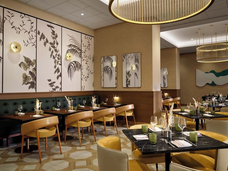 Savor a stylish dinner in the warmly lit dining room.