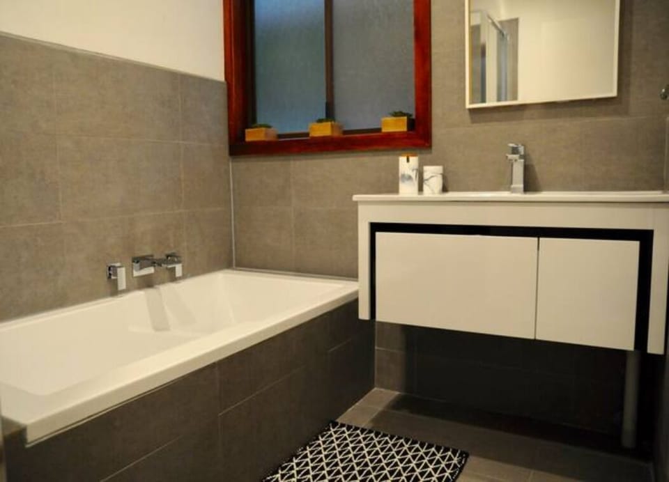 Modern bathroom with separate shower & bath