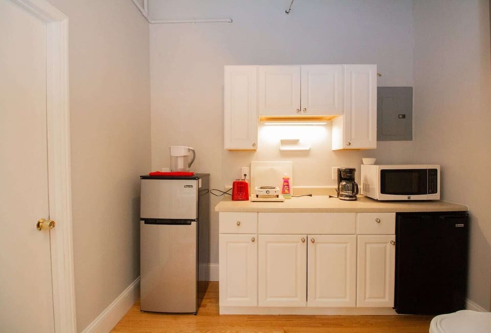 Galley Kitchenette, Comes with hot plate, Mini-fridge and mini-freezer, microwave, coffee machine