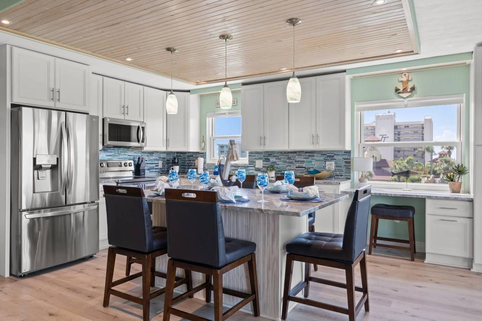 Updated Kitchen with Stainless Steel Appliances, Soft Close Cabinets, and a Built-in Workspace (with a partial view of the Gulf of Mexico!)