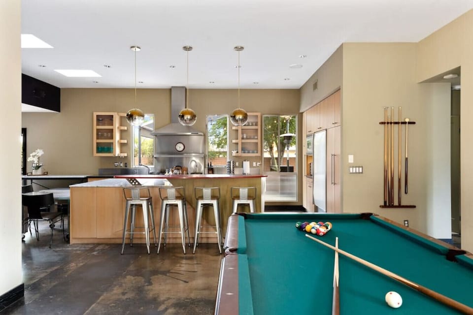 Play a game of billiards with a view of the kitchen island—fun and social all in one space!