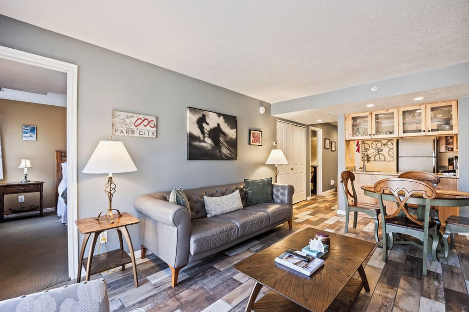 Comfortable living room with seating that opens into the dining area, creating a welcoming shared space.