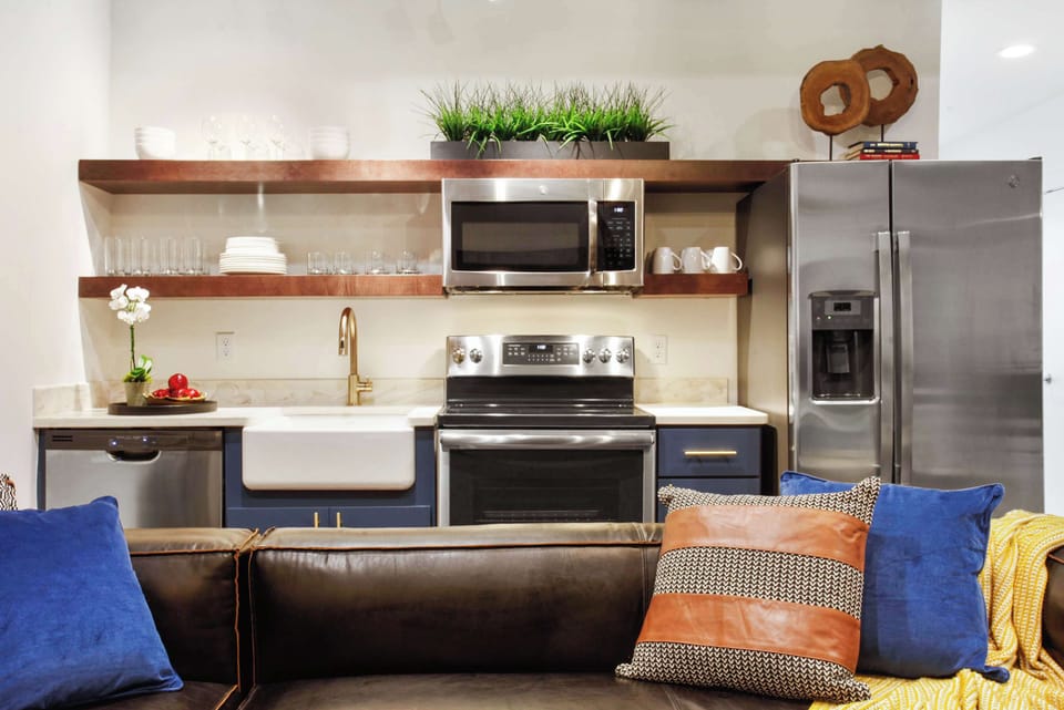 Unit 201 | Open Concept Chef's Kitchen | Fully Stocked | Open to Living | First Floor of Second Floor Unit