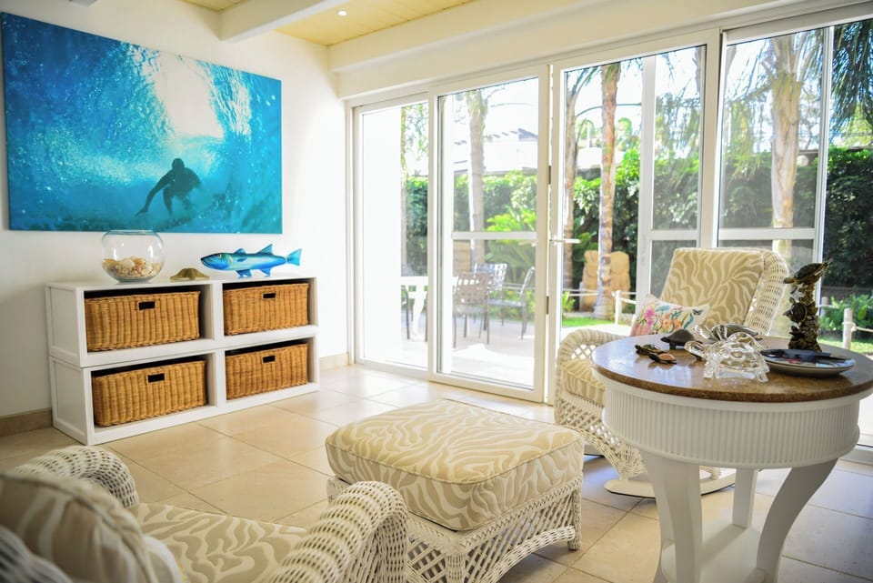 Read a book Sitting on these rocking chairs near a terrace with a garden trail.