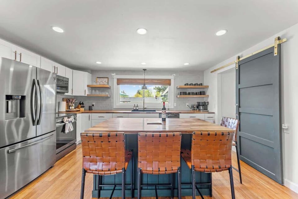 Kitchen (complementary bottle of wine, welcome guide, stainless steel appliances, butcher block island with four chairs, fully stocked with all cooking essentials)