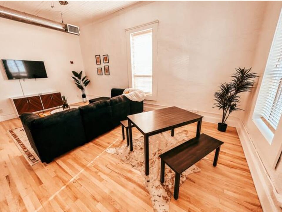 Open living and dining room with lots of natural light. 
