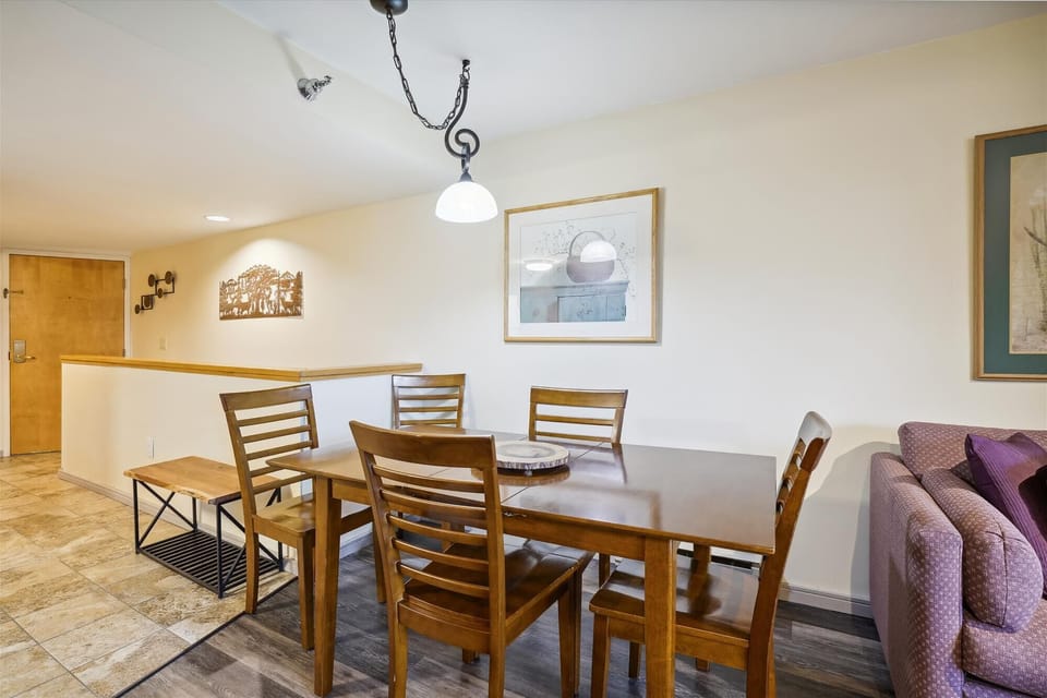 A spacious dining table offers plenty of seating for shared dinners, games, or morning coffee.