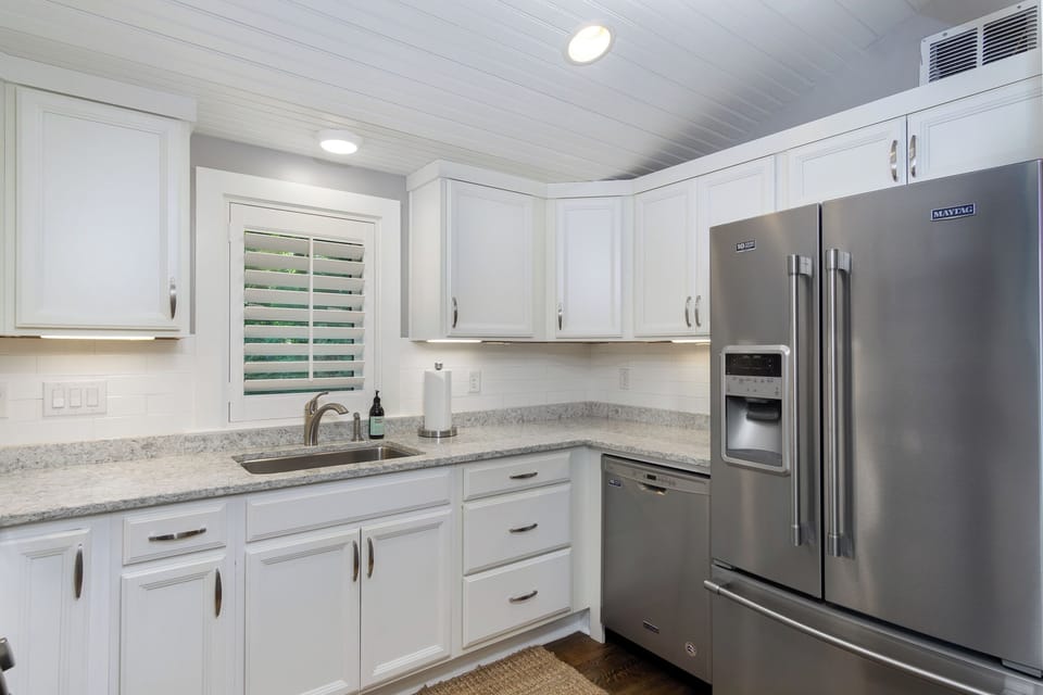 Main level kitchen with a dishwasher & duo coffeemaker (drip-style + Keurig).