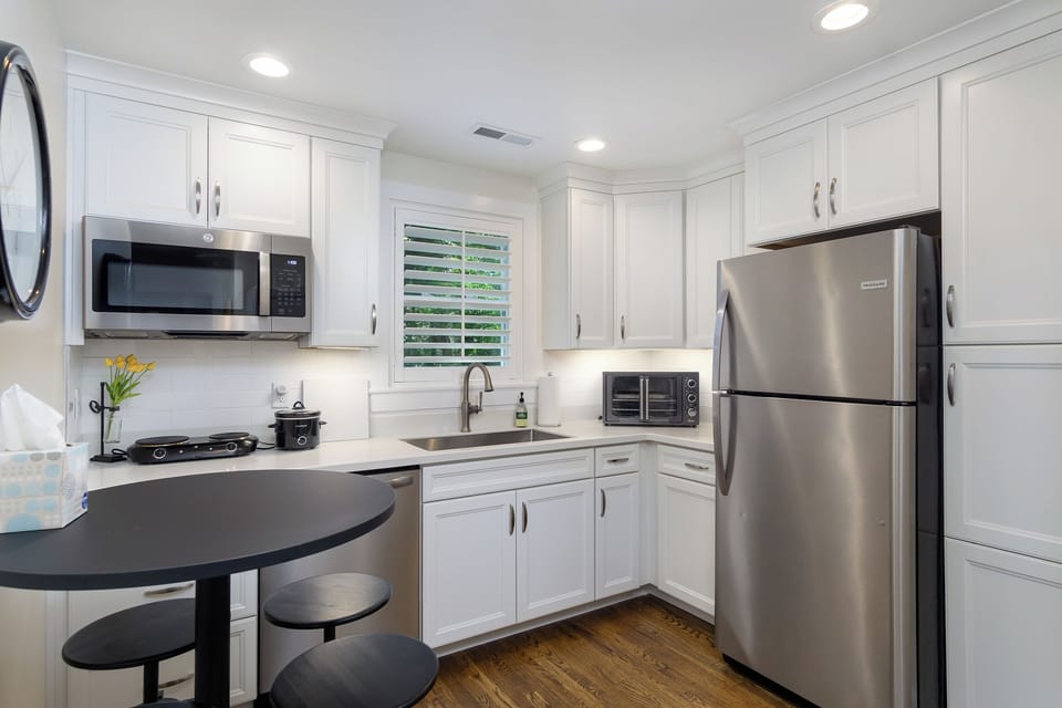 Upper-level kitchen with hot plate, instant pot, toaster oven & dishwasher.