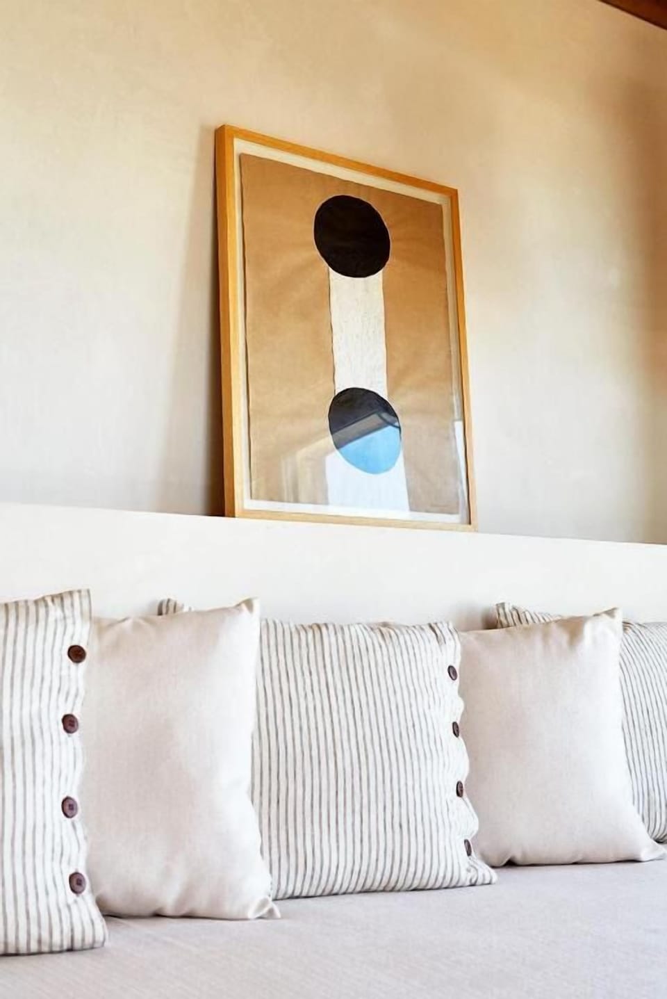Lounge against plush pillows in a calming, minimalist retreat.