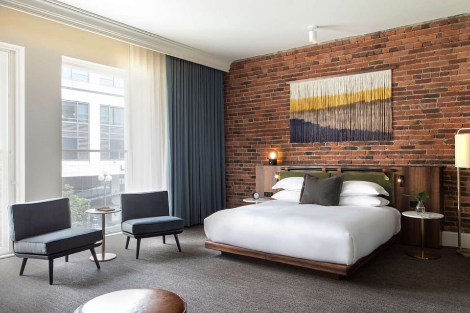 Unwind in a sunlit room with exposed brick charm.
