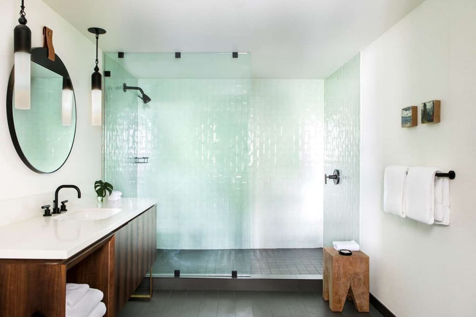 Refresh in a spa-like bath with a glass walk-in shower.