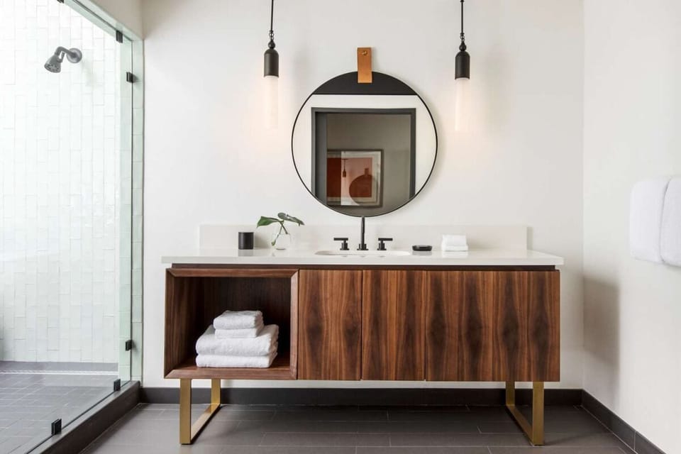 Start your day at a designer vanity with plush folded towels.