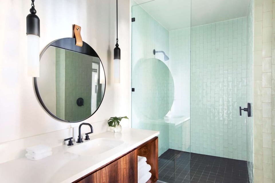 Start your day at a bright vanity with modern fixtures.
