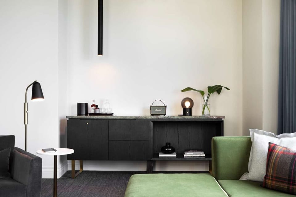 Sip a late-night drink from your in-room refreshment setup.