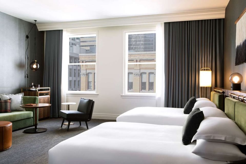 Stretch out with two plush beds and a relaxed lounge corner.