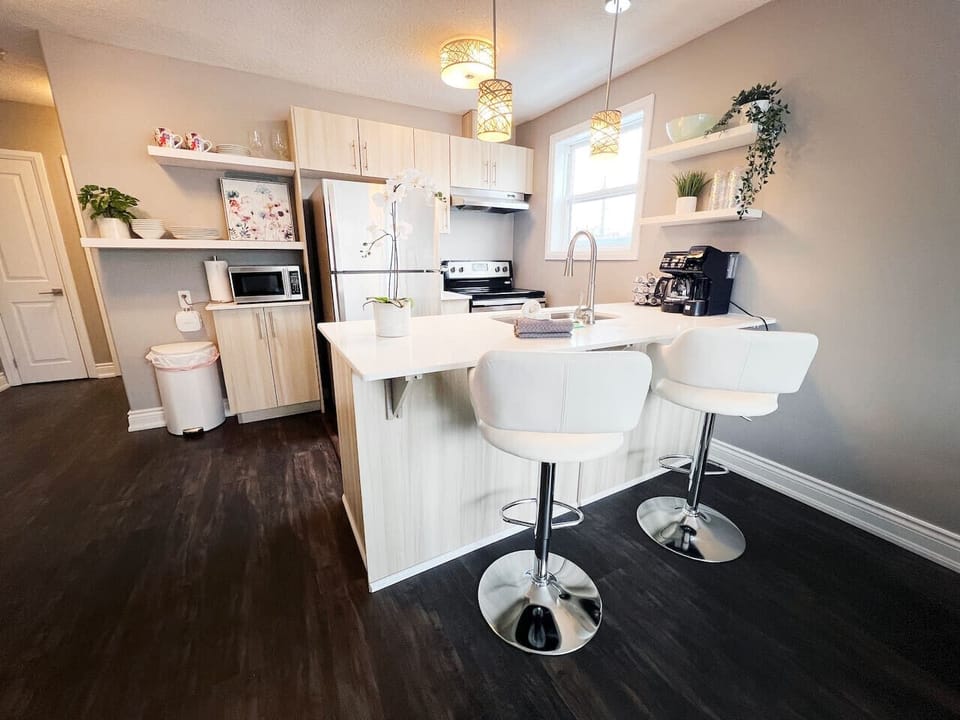 A stylish kitchen island sets the stage for dining and conversation.