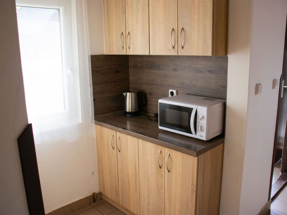 Cabinetry, Countertop, Kitchen Appliance, Kitchen, Home Appliance, Wood, Kitchen Stove, Sink, Major Appliance, Flooring