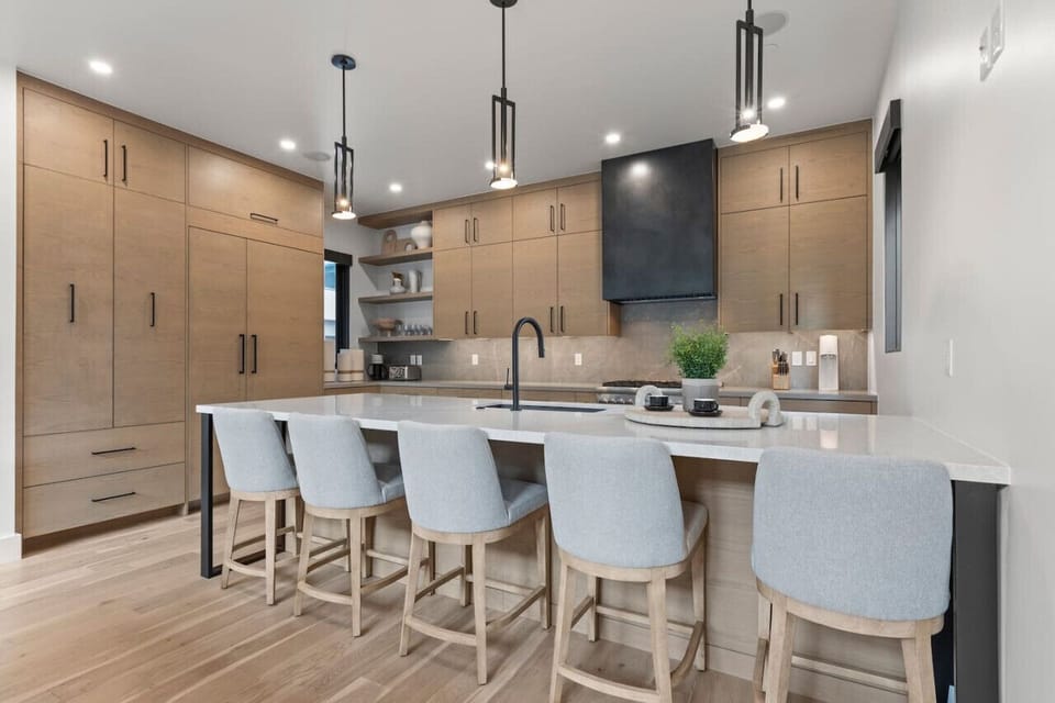 The open kitchen features bar seating for five, keeping the conversation flowing while meals are prepared