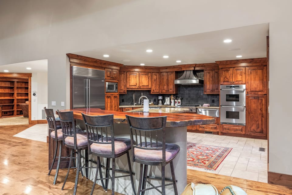 Whip up a feast in our chef's kitchen, complete with a large granite island, stainless steel appliances, and all the essentials for memorable meals.