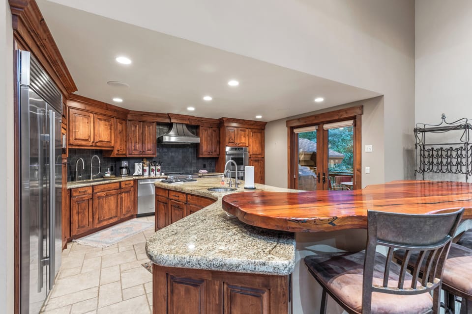 Whip up a feast in our chef's kitchen, complete with a large granite island, stainless steel appliances, and all the essentials for memorable meals.
