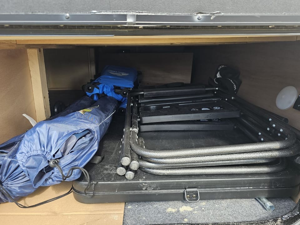 4 Chairs, 1 Cart, Grill, and a table available.