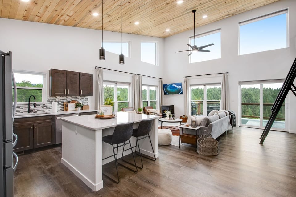 Floor-to-ceiling windows w/ electric shades. Light floods this space.