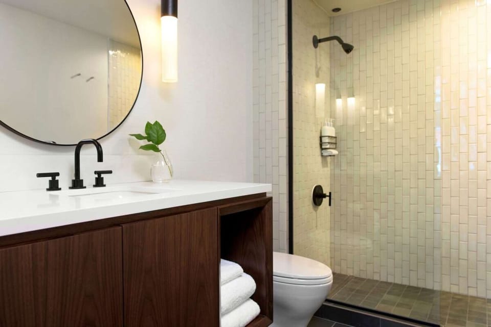 Rinse off in a glass shower with spa-clean finishes.