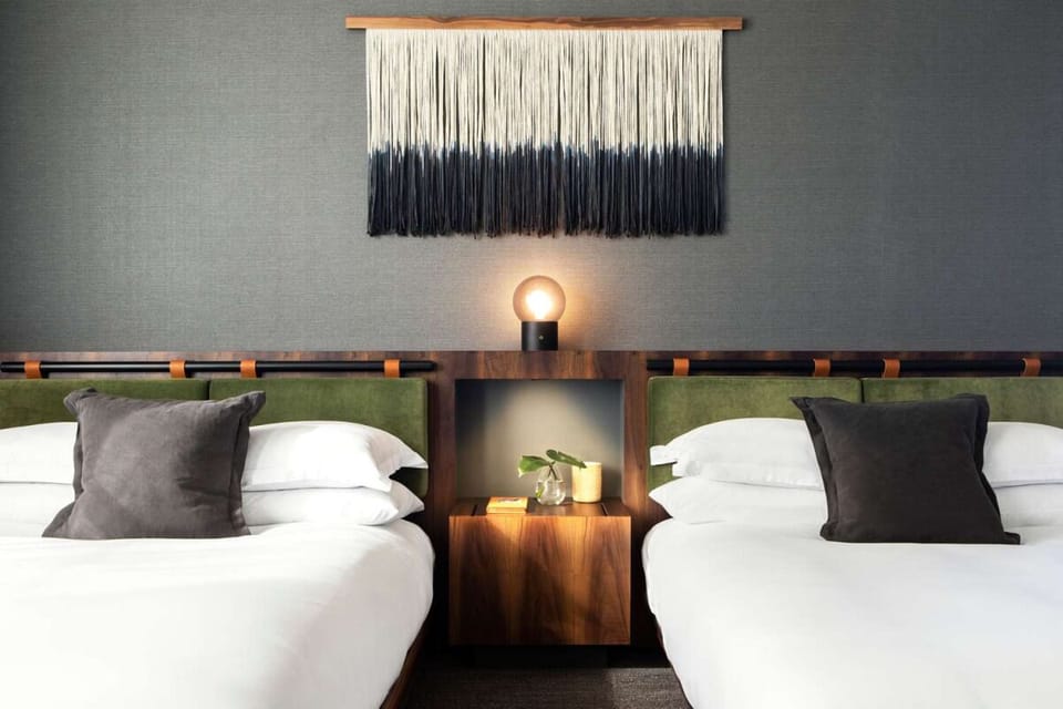 Settle in with symmetrical bedsides and calming designer textures.