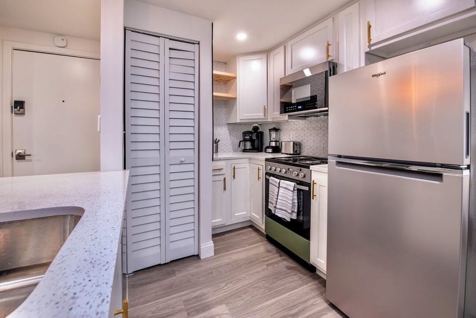 Stay Fresh, Dine in Style 🍴❄️ Experience comfort and convenience with our Airbnb's modern kitchen and generously-sized refrigerator.
