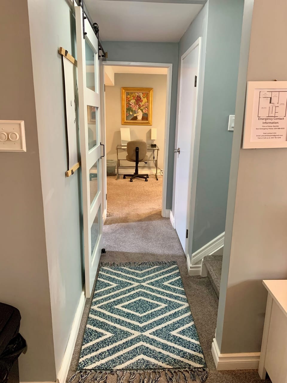 Hall showing entry and connection between bedroom and living area