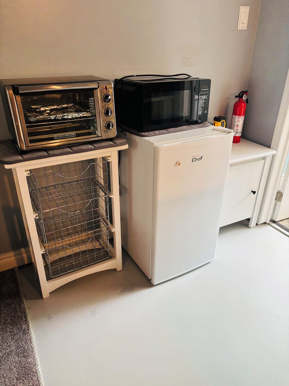 Microwave, mini fridge, toaster oven and toaster all included.