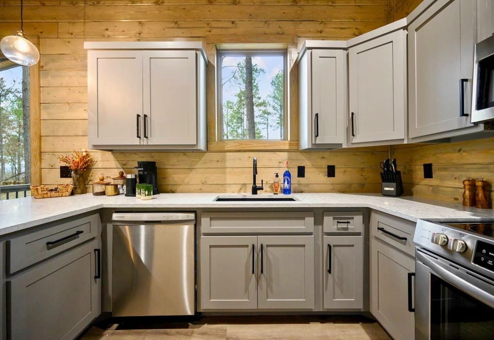 The kitchen window offers a lovely view while you cook.