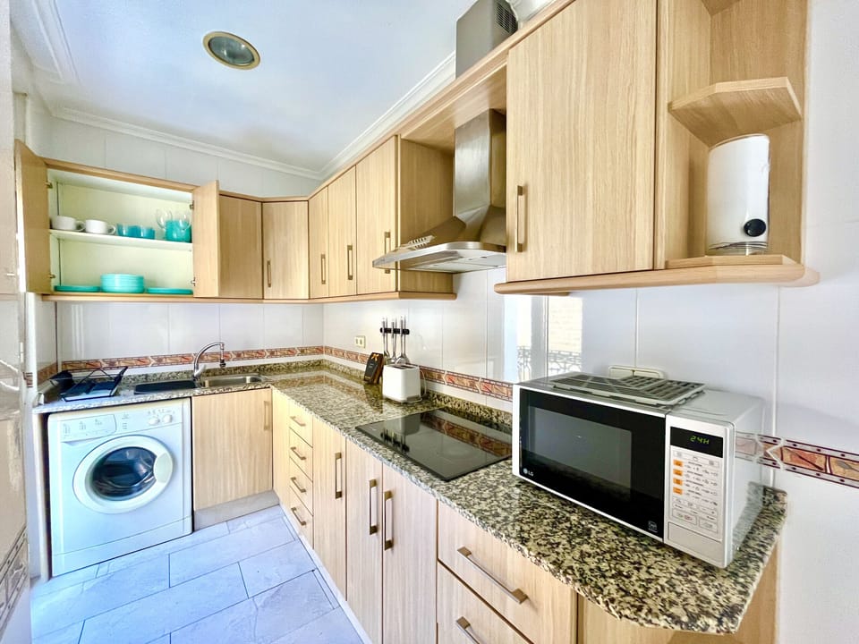 Make yourself at home and enjoy a fully equipped kitchen with a coffee maker, kettle, microwave, and washing machine for a comfortable and convenient stay.